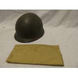 A steel combat helmet with leather liner and a US khaki cotton side hat (2)