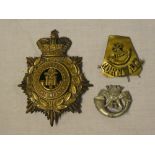A brass ordinary ranks helmet plate of the Duke of Cornwall's Light Infantry with detachable centre,