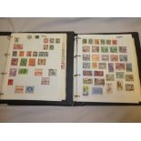 A pair of folder albums containing a collection of British Commonwealth stamps