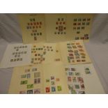 A collection of Trinidad and Tobago stamps on album leaves,