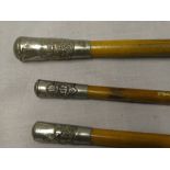 Three military swagger sticks with nickel tops including Hampshire Regt,