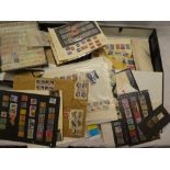 Two box files containing a selection of USA and Canada stamps on album leaves, stock cards,