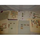 Two albums and numerous album pages of mixed World stamps