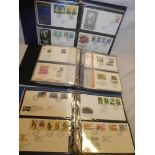 Three albums containing a large selection of GB first day covers 1970's-1990's