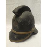 An old brass mounted leather Firemans helmet with NFS badge complete with liner and chinstrap,