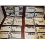 Six albums containing a collection of GB first day covers 1980 - 2014
