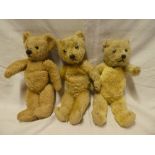 Three various old plush covered teddy bears
