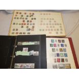 Two albums and a stockbook containing GB stamps,