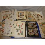 Four folder albums containing a selection of mixed World stamps together with numerous packets of