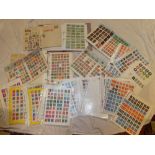 A large box containing a large selection of World stamps in albums, packets, boxes,