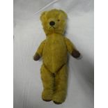 An old plush covered teddy bear 17" long
