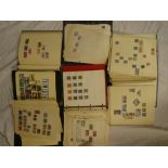 Five folder albums containing a selection of GB and World stamps
