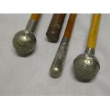 Three military swagger sticks with nickel tops including Victorian Devonshire Regt,