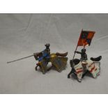 A pair of diecast knights on horseback with lance and standard