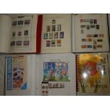 Four albums containing a collection of USA stamps including two albums of mainly mint stamps -