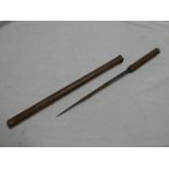 A leather military swagger stick with concealed dagger with single edged blade