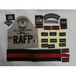A collection of RAF police insignia and other badges including RAF police arm band, titles,