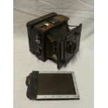 An old leather-mounted plate camera by Goerz of Berlin retailed by W H Tomkinson of Liverpool with