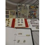 Four folder albums and two stockbooks containing GB used machins and commemorative stamps,