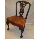 An ealry to mid 19th Century carved mahogany Hepplewhite-style dining chair with pierced splat