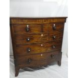 A mid 19th Century mahogany bow front chest of two short and three long drawers with turned handles