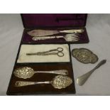 A good quality electroplated fish serving knife and fork with engraved decoration in velvet lined