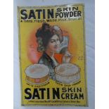 An embossed metal rectangular advertising sign "Satin Skin Powder/Satin Skin Cream" 17" x 11"
