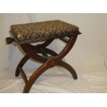 An Edwardian mahogany X-frame stool with rectangular upholstered seat