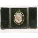 A miniature watercolour on ivory depicting bust portrait of a young child,