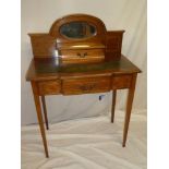 An Edwardian inlaid mahogany ladies writing table with a single drawer in the frieze,