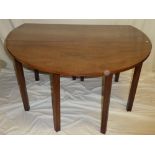 A 19th Century figured mahogany oval drop leaf dining table on square-shaped legs 66" x 53" overall