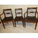 A set of five single and two carver 19th Century mahogany dining chairs,