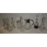 A good quality glass wine jug with silver plated mounts,