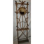 An unusual old bent wood hall stand with central bevelled circular mirror