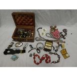 A selection of various costume jewellery including necklaces, brooches, silver mounted shoe horn,