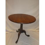 A 19th Century mahogany circular snap-top occasional table with turned column and tripod base