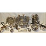 A selection of various silver plated items including three-piece oval tea set, pair of candelabra,