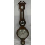 A 19th Century mercury barometer with silvered circular dial, mirror,