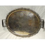 A large silver plated oval two-handled tea tray with engraved decoration and raised grape and leaf