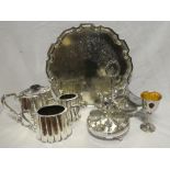 A silver plated three-piece tea set, circular tray, egg cruet,