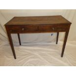 An early 19th Century mahogany cross-banded rectangular side table with two drawers in the frieze