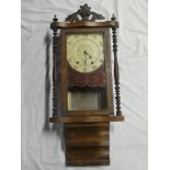 A 19th Century wall clock with painted circular dial in inlaid walnut rectangular case with column