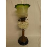A Victorian brass oil lamp with column stem,