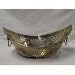 A 19th Century Sheffield plate oval bread basket with pierced decoration and lions mask handles