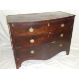 A small 19th Century mahogany bow front chest of two short and two long drawers with brass ring