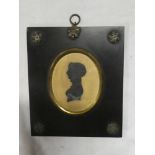 A 19th Century miniature silhouette depicting a bust portrait of a female,