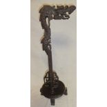 A Chinese rosewood lamp stand with dragon decoration,