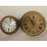 A brass nautical-style wall clock with painted circular dial,
