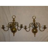 A pair of good quality brass three branch wall mounted candle lights with scroll decoration