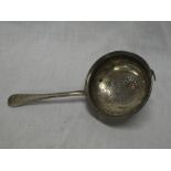 A 19th Century silver circular sifting funnel with tapered handle,